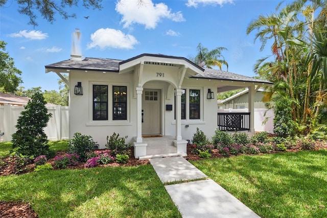 791 44th Ave N, Saint Petersburg, FL 33703 - view of front facade featuring stucco siding and roof with shingles
