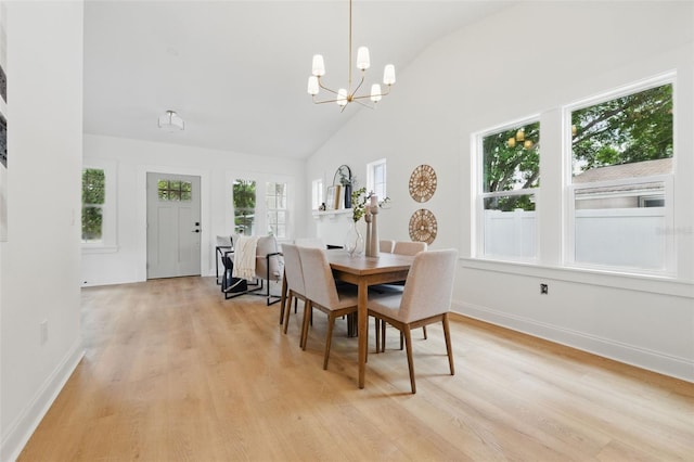791 44th Ave N, Saint Petersburg, FL 33703 - dining space featuring lofted ceiling, light wood-style flooring, a chandelier, and baseboards