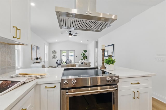 791 44th Ave N, Saint Petersburg, FL 33703 - kitchen featuring electric range, island range hood, light countertops, open floor plan, and a ceiling fan