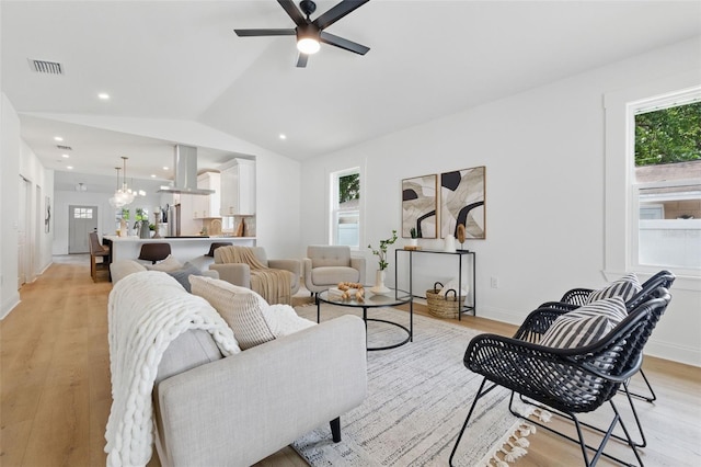 791 44th Ave N, Saint Petersburg, FL 33703 - living room featuring light wood finished floors, lofted ceiling, ceiling fan, baseboards, and recessed lighting