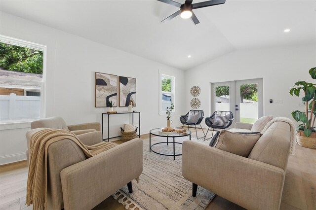 791 44th Ave N, Saint Petersburg, FL 33703 - living room featuring light wood-style flooring, a ceiling fan, lofted ceiling, recessed lighting, and french doors