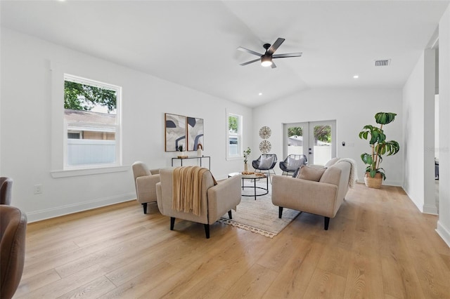 791 44th Ave N, Saint Petersburg, FL 33703 - living room with healthy amount of natural light, light wood-type flooring, ceiling fan, vaulted ceiling, and french doors
