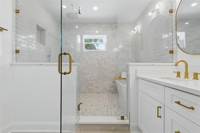 791 44th Ave N, Saint Petersburg, FL 33703 - bathroom featuring vanity, a shower stall, and a freestanding tub