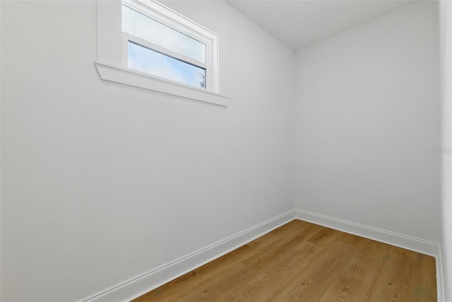 791 44th Ave N, Saint Petersburg, FL 33703 - spare room featuring baseboards and wood finished floors