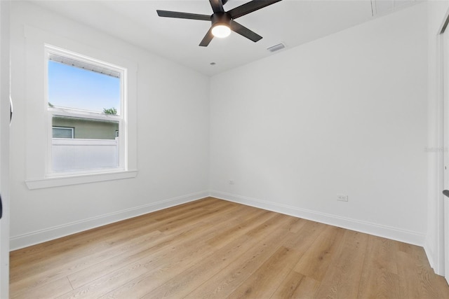 791 44th Ave N, Saint Petersburg, FL 33703 - spare room featuring light wood-type flooring, a ceiling fan, and baseboards