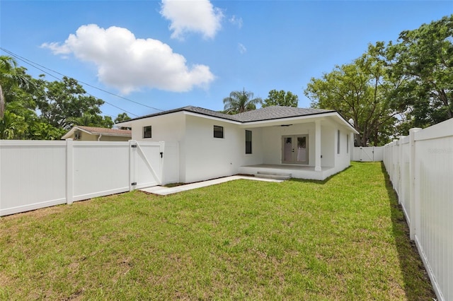 791 44th Ave N, Saint Petersburg, FL 33703 - back of property featuring a gate, french doors, stucco siding, and a patio