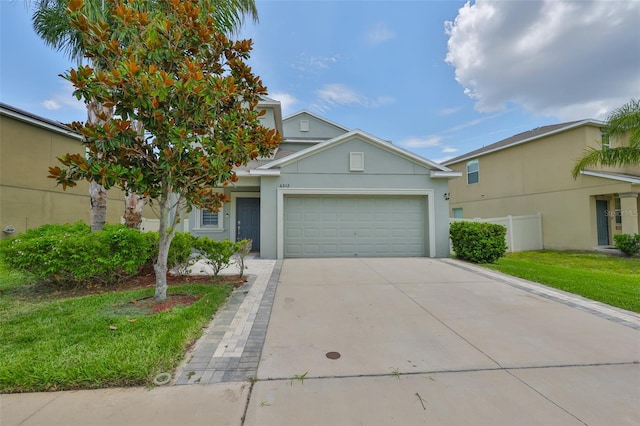 6512 Trent Creek Dr, Sun City Center, FL 33573 - view of front of home with a garage, stucco siding, concrete driveway, and a front yard