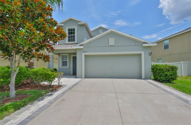 6512 Trent Creek Dr, Sun City Center, FL 33573 - traditional-style house with stucco siding, driveway, and a garage
