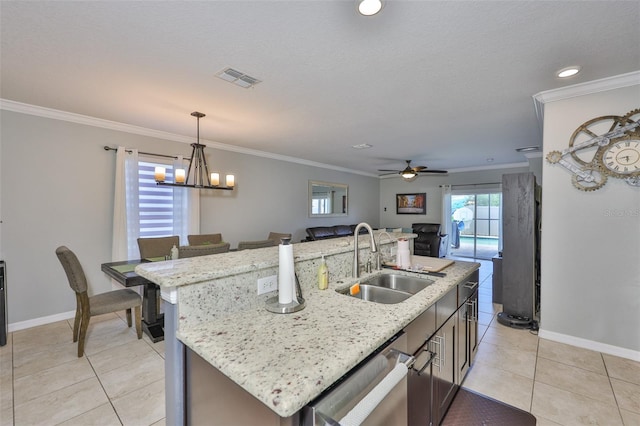 6512 Trent Creek Dr, Sun City Center, FL 33573 - kitchen with a sink, stainless steel dishwasher, light tile patterned floors, decorative light fixtures, and crown molding