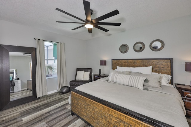 6512 Trent Creek Dr, Sun City Center, FL 33573 - bedroom with wood finished floors, ceiling fan, baseboards, and a textured ceiling