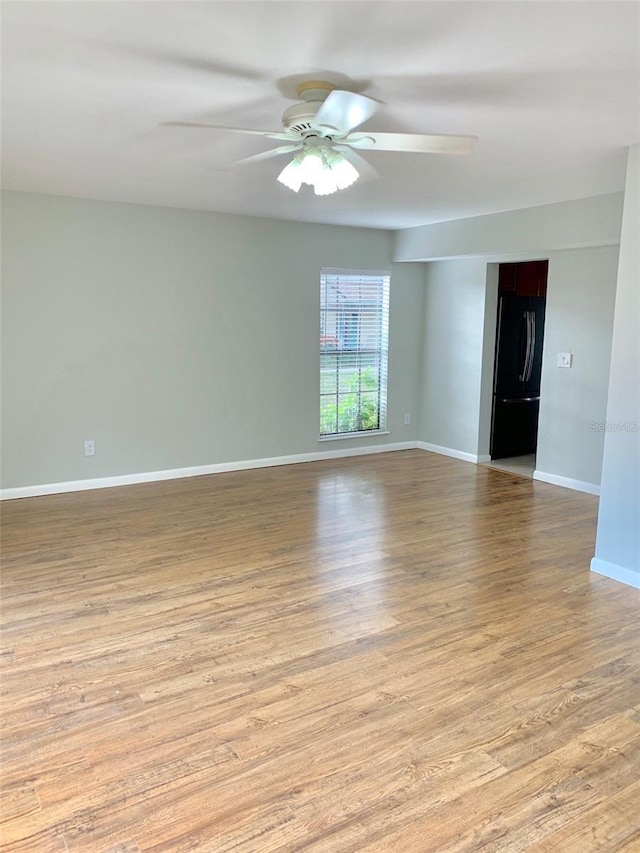 1515 Bayshore Blvd Unit 38, Dunedin, FL 34698 - empty room with a ceiling fan and light wood-style flooring
