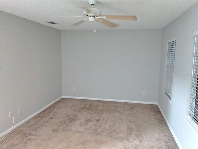 1515 Bayshore Blvd Unit 38, Dunedin, FL 34698 - carpeted spare room featuring a ceiling fan and a textured ceiling