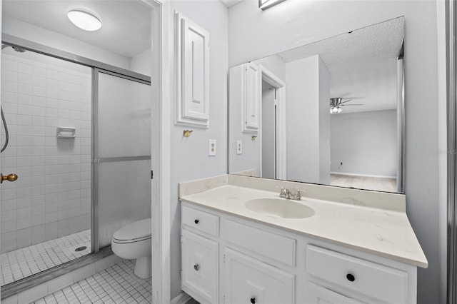 4160 Player Cir Unit 109, Orlando, FL 32808 - full bathroom featuring ceiling fan, a shower stall, toilet, vanity, and a textured ceiling