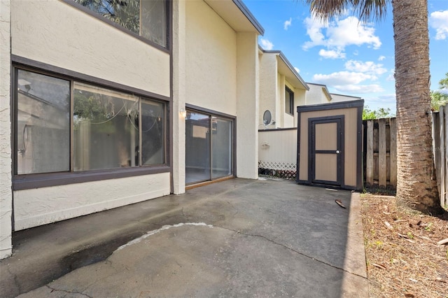 4160 Player Cir Unit 109, Orlando, FL 32808 - view of side of home with a patio area and stucco siding