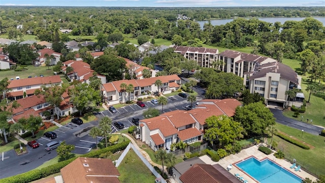 4160 Player Cir Unit 109, Orlando, FL 32808 - aerial overview of property's location featuring a nearby body of water, a heavily wooded area, and a pool area