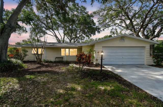 5825 Oakhurst Dr, Seminole, FL 33772 - ranch-style home with an attached garage and driveway