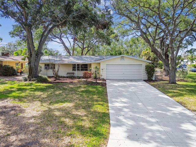5825 Oakhurst Dr, Seminole, FL 33772 - ranch-style house with a garage, driveway, and a front lawn