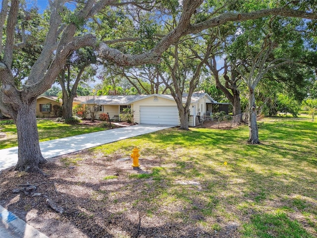 5825 Oakhurst Dr, Seminole, FL 33772 - ranch-style home featuring an attached garage, driveway, and a front lawn