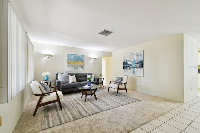 5825 Oakhurst Dr, Seminole, FL 33772 - carpeted living area featuring tile patterned flooring