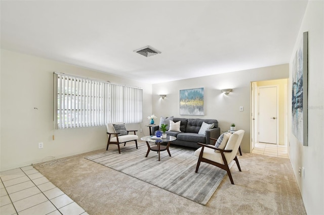 5825 Oakhurst Dr, Seminole, FL 33772 - living room with light carpet and light tile patterned floors