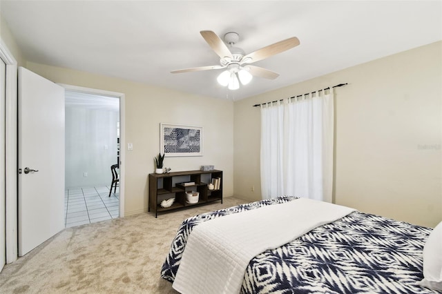 5825 Oakhurst Dr, Seminole, FL 33772 - carpeted bedroom featuring ceiling fan and tile patterned floors