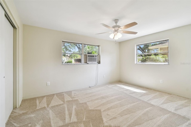5825 Oakhurst Dr, Seminole, FL 33772 - unfurnished bedroom with multiple windows, carpet floors, a closet, and baseboards