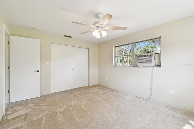 5825 Oakhurst Dr, Seminole, FL 33772 - unfurnished bedroom with cooling unit, carpet, a closet, and ceiling fan