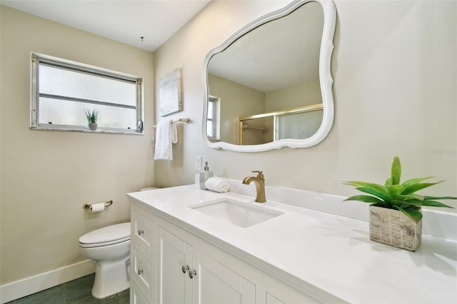 5825 Oakhurst Dr, Seminole, FL 33772 - bathroom with vanity, toilet, tile patterned flooring, baseboards, and a shower with shower door