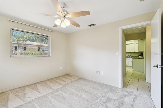 5825 Oakhurst Dr, Seminole, FL 33772 - unfurnished room featuring light carpet, ceiling fan, and baseboards
