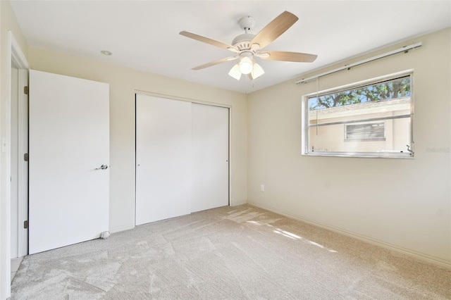 5825 Oakhurst Dr, Seminole, FL 33772 - unfurnished bedroom featuring carpet floors, a closet, baseboards, and ceiling fan
