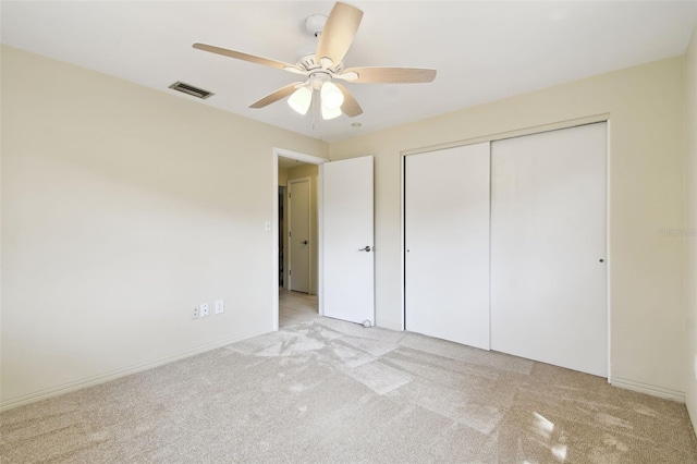 5825 Oakhurst Dr, Seminole, FL 33772 - unfurnished bedroom featuring light colored carpet, a closet, and ceiling fan