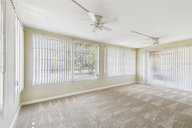 5825 Oakhurst Dr, Seminole, FL 33772 - unfurnished room with a ceiling fan, carpet, and baseboards