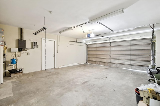5825 Oakhurst Dr, Seminole, FL 33772 - garage featuring a garage door opener and electric panel