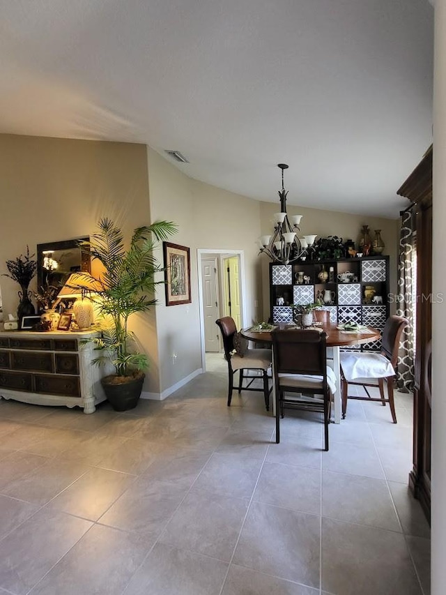 4471 Marsh Harbor Dr, Tavares, FL 32778 - tiled dining area featuring vaulted ceiling, a chandelier, and baseboards