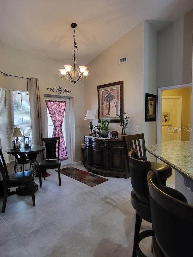 4471 Marsh Harbor Dr, Tavares, FL 32778 - dining area featuring a chandelier and lofted ceiling