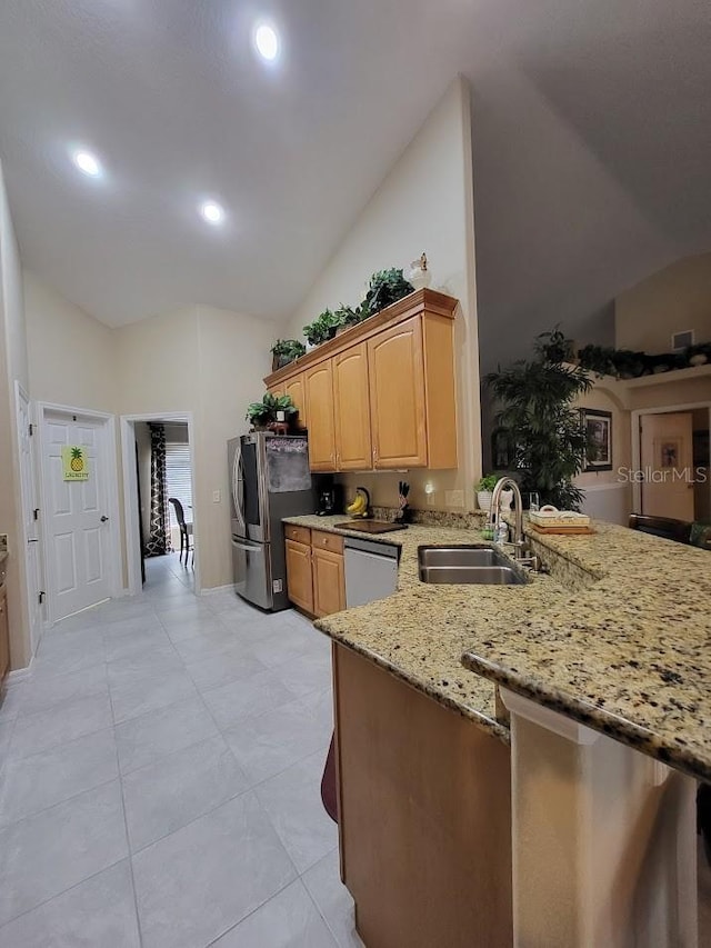 4471 Marsh Harbor Dr, Tavares, FL 32778 - kitchen featuring a sink, appliances with stainless steel finishes, light stone counters, high vaulted ceiling, and recessed lighting