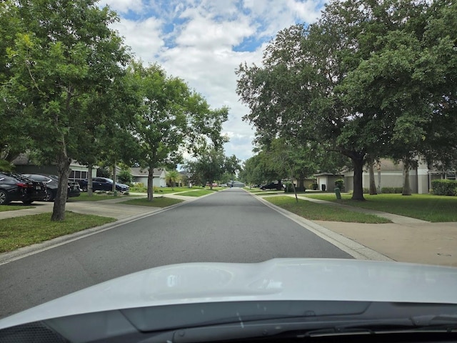 4471 Marsh Harbor Dr, Tavares, FL 32778 - view of asphalt road with a residential view and sidewalks