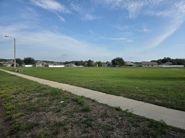 4471 Marsh Harbor Dr, Tavares, FL 32778 - view of community featuring a lawn and a residential view