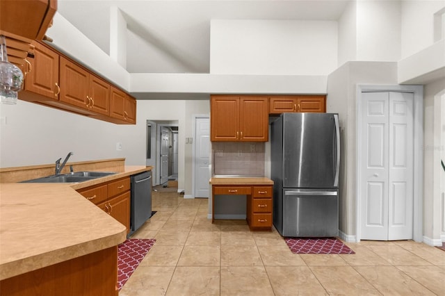 8518 N Linwood Loop, Citrus Springs, FL 34433 - kitchen featuring freestanding refrigerator, high vaulted ceiling, dishwasher, a sink, and brown cabinetry