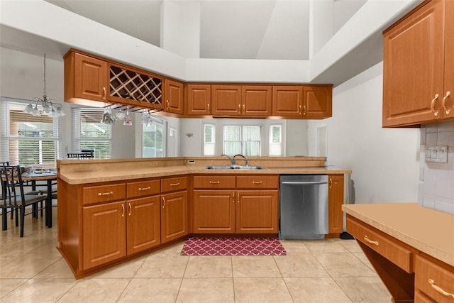 8518 N Linwood Loop, Citrus Springs, FL 34433 - kitchen featuring dishwasher, a sink, brown cabinetry, and a towering ceiling