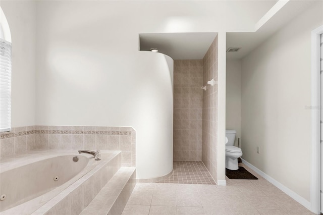 8518 N Linwood Loop, Citrus Springs, FL 34433 - bathroom with toilet, a jetted tub, tile patterned flooring, and tiled shower
