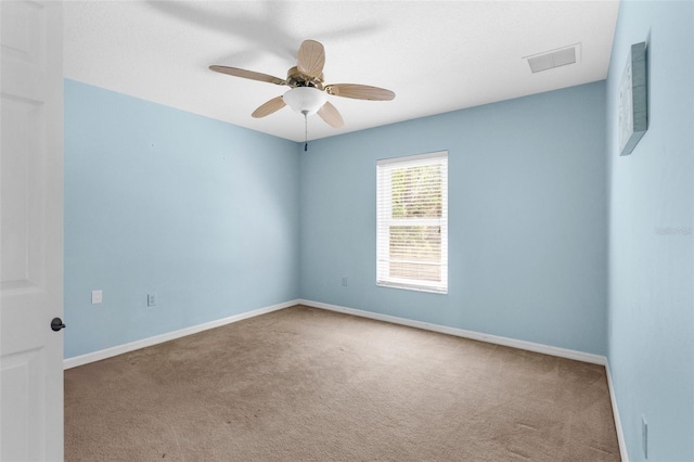 8518 N Linwood Loop, Citrus Springs, FL 34433 - unfurnished room with carpet floors, a ceiling fan, and baseboards