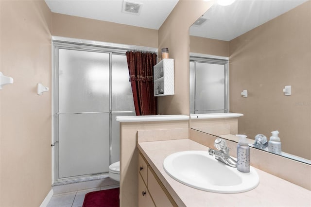 8518 N Linwood Loop, Citrus Springs, FL 34433 - bathroom with toilet, vanity, a stall shower, tile patterned floors, and baseboards