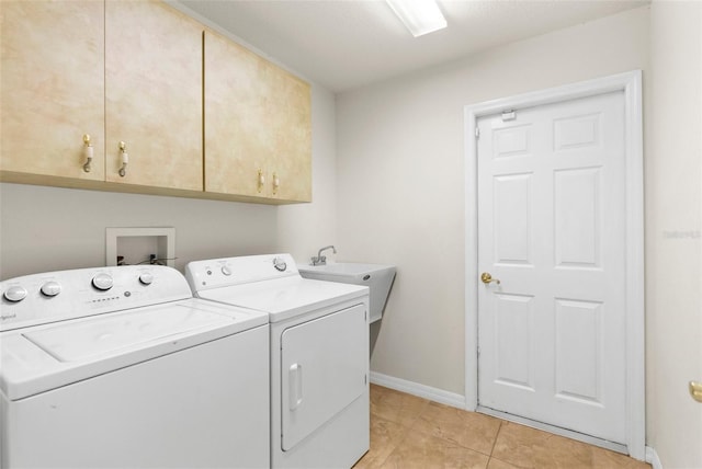 8518 N Linwood Loop, Citrus Springs, FL 34433 - washroom featuring cabinet space, separate washer and dryer, baseboards, and light tile patterned floors