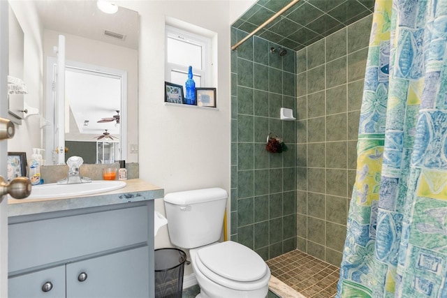 8518 N Linwood Loop, Citrus Springs, FL 34433 - bathroom featuring vanity, a ceiling fan, toilet, and a tile shower