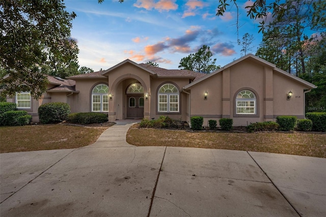 8518 N Linwood Loop, Citrus Springs, FL 34433 - view of front of house featuring stucco siding and a front yard