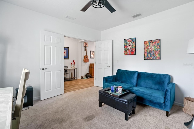 5511 Badini Way, Palmetto, FL 34221 - living room featuring a ceiling fan, carpet floors, and baseboards