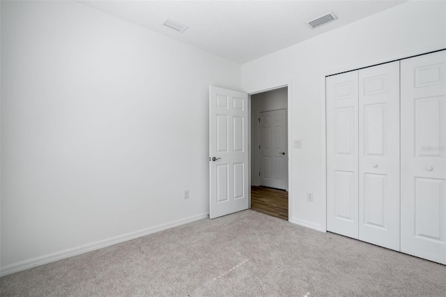 5511 Badini Way, Palmetto, FL 34221 - unfurnished bedroom with carpet floors, baseboards, and a closet