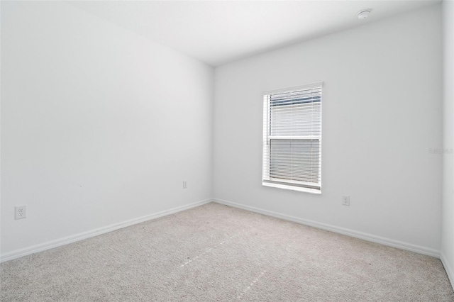 5511 Badini Way, Palmetto, FL 34221 - spare room with light carpet, baseboards, and a smoke detector