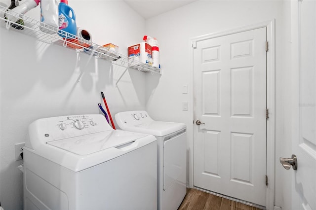5511 Badini Way, Palmetto, FL 34221 - laundry room with washer and dryer and dark wood-style floors